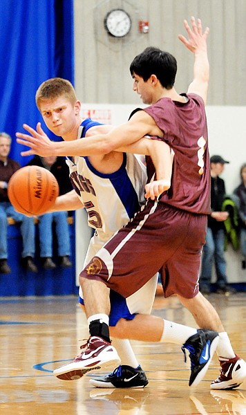 &lt;p&gt;&#160;Bigfork senior Ian Lorang drives by Troy senior guard Creede
Garcia (1) during&#160; Friday&#146;s District 7B game in Bigfork.&lt;/p&gt;