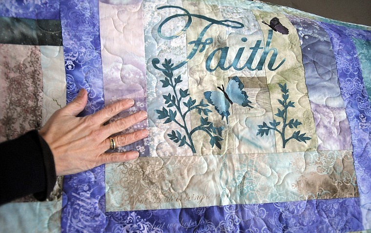 The quilt was inspired by and includes McKenna Ryan &#147;Faith, Hope, Love&#148; art quilt series blocks, with a &#147;Faith&#148; block signed by Ryan.