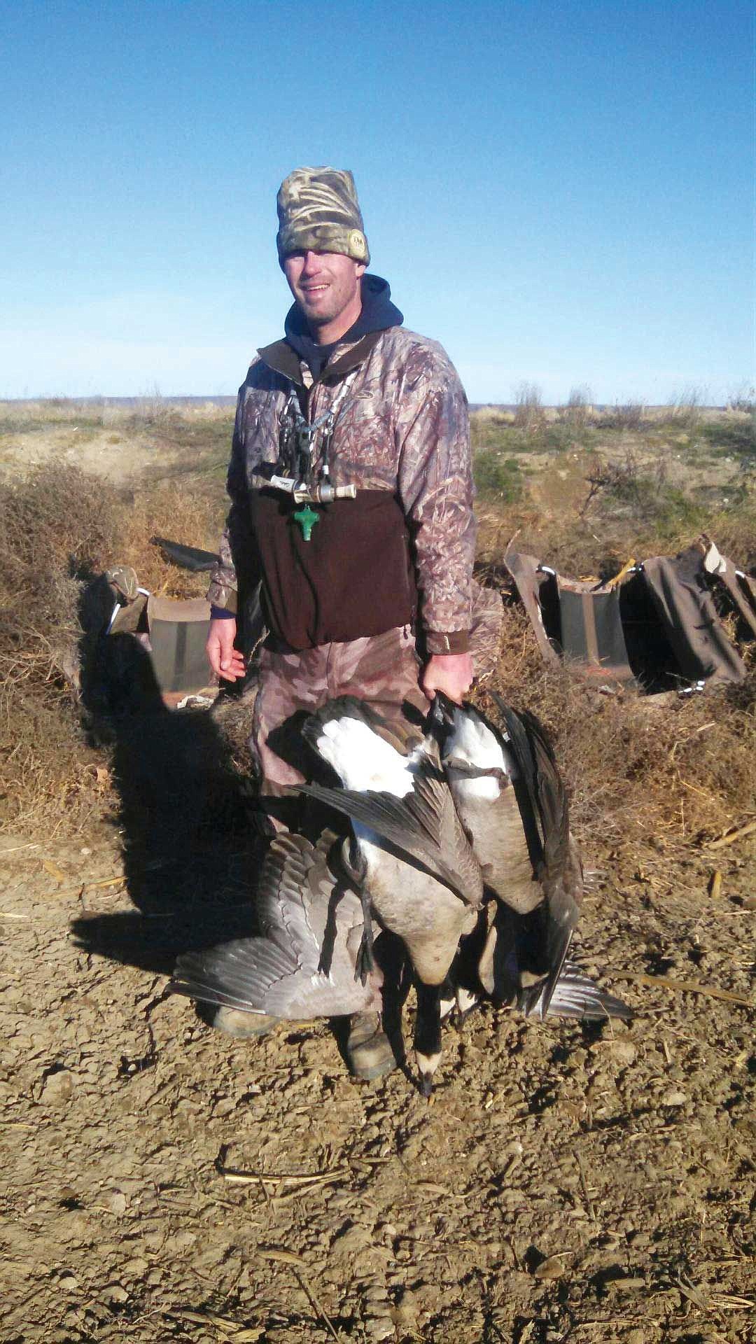 Meseberg Adventures owner, Levi Meseberg, shows a couple of big geese harvested on a Royal Slope hunt.