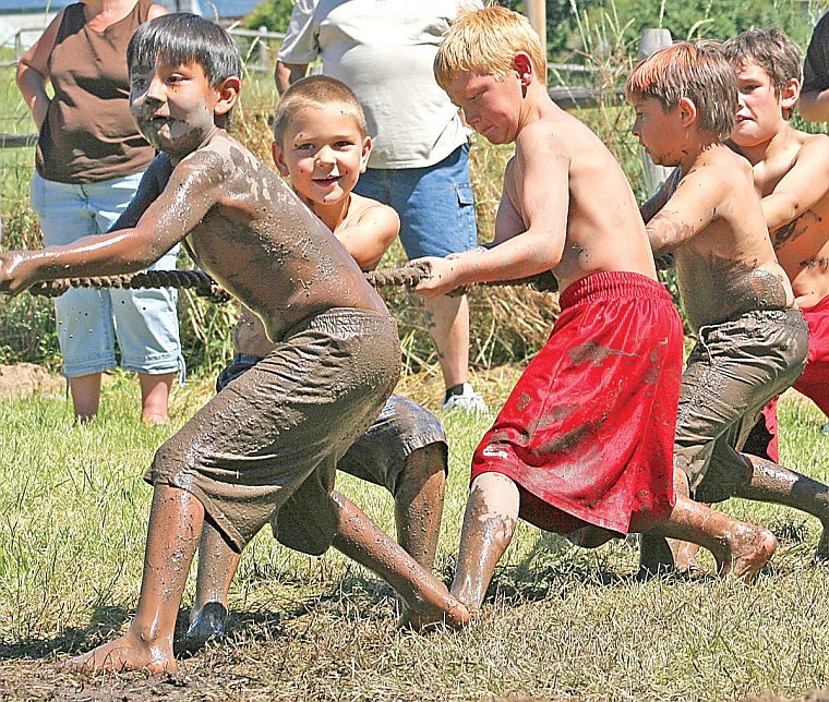 &lt;p&gt;Jace Matt, 8, mans the front line of the rope pull contest. He
and his friends, including Jack Rodgiro, were eventually pulled
into the mud pit, but the boys seemed to enjoy getting the chance
to cool off.&lt;/p&gt;