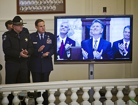 &lt;p&gt;Col. Jerry Russell, commander of the Idaho State Police, left, and Brig. Gen. Richard Turner, chief of staff joint headquarters of the Idaho Air National Guard, applaud with Gov. Butch Otter during the State of the State address Monday Jan. 9, 2012 at the Statehouse in Boise, Idaho. The governor stopped at several points in his speech to acknowledge individuals for their civic and military service to the state of Idaho. (AP Photo/Idaho Statesman, Darin Oswald)&lt;/p&gt;