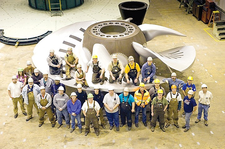 Grant PUD's Wanapum Advance Turbine Crew gathers together for a group photo at Wanapum Dam. Improvements at Wanapum Dam result in a 3 percent capacity gain.