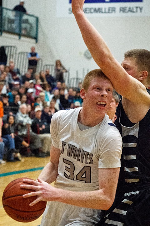 <p>SHAWN GUST/Press Lake City's Kyle Guice draws the foul from a Post Falls defender Tuesday during the fourth quarter in Coeur d'Alene.</p>