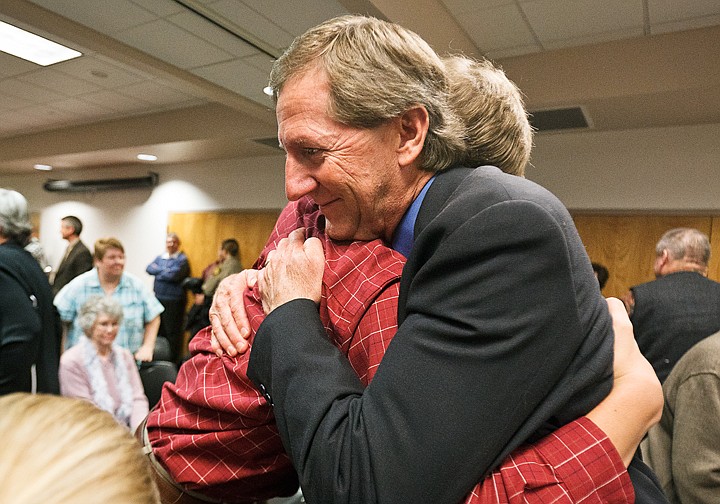 &lt;p&gt;Incoming Kootenai County Commissioner, Dan Green, hugs his son, Brett, 18, following a swearing-in ceremony.&lt;/p&gt;