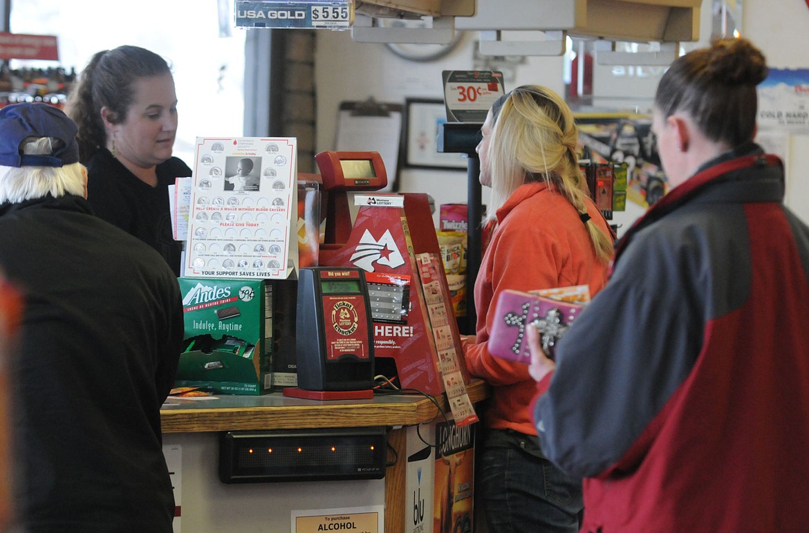 &lt;p&gt;&lt;strong&gt;Jena Clark&lt;/strong&gt; sells Powerball Lottery tickets as customers wait in line to buy tickets at the Appleway Conoco on Tuesday. Clark said on a regular day they sell about $100 of tickets, but on Tuesday they had sold around $900 by 3 p.m. (Aaric Bryan/Daily Inter Lake)&lt;/p&gt;