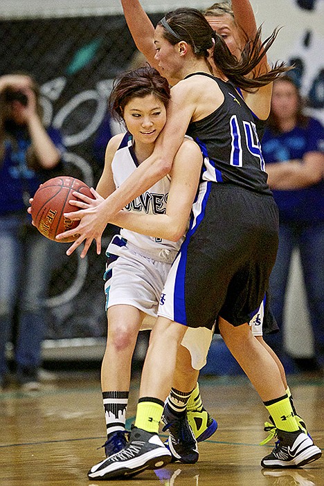 &lt;p&gt;Coeur d'Alene High's Brittany Tackett, right, blocks the path of Hailey Jackson from Lake City during the second half.&lt;/p&gt;