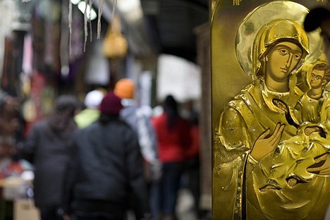 &lt;p&gt;People pass by an depiction of the Virgin Mary displayed in a street inside Jerusalem's Old City, Tuesday. Israel is inviting tourists to retrace the footsteps of the Virgin Mary, part of a growing campaign to bring Christian pilgrims to the Holy Land. A new itinerary developed by the Tourism Ministry helps tour operators plan pilgrimages to sites where the mother of Jesus Christ lived and traveled.&lt;/p&gt;