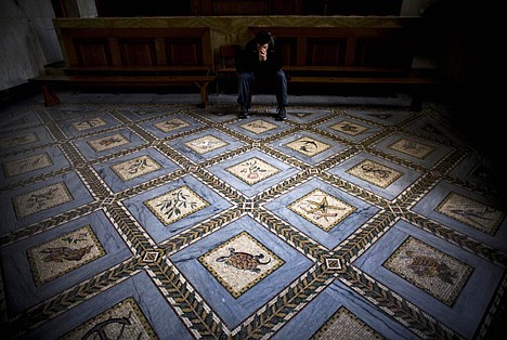 &lt;p&gt;A Christian pilgrim pauses inside the Visitation Church in the Jerusalem neighborhood of Ein Kerem, Tuesday. Israel is inviting tourists to retrace the footsteps of the Virgin Mary, part of a growing campaign to bring Christian pilgrims to the Holy Land. A new itinerary developed by the Tourism Ministry helps tour operators plan pilgrimages to sites where the mother of Jesus Christ lived and traveled.&lt;/p&gt;