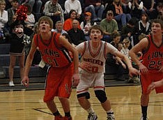 Plains Senior Andrew Baker jostles for position with a Eureka player during the Horsemen's loss on Saturday.