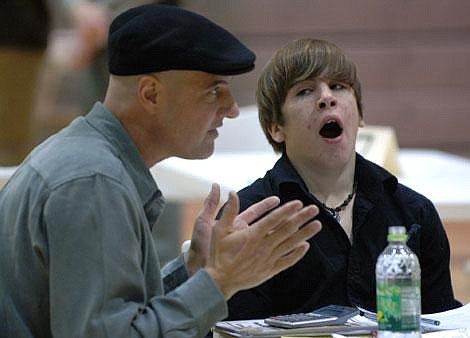 Flathead High School ninth-grader Dillan Foster yawns while Flathead Investment Club Founder Michael Blend talks to students during a career fields fair on Thursday. Garrett Cheen photos/Daily Inter Lake