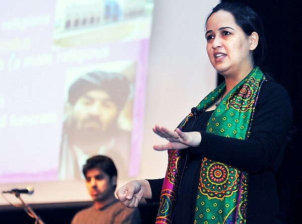 Shaima Khinjani and her husband Faeez Akram (background) answer questions from Flathead High School students after delivering a presentation titled, &quot;Afghanistan from Afghans' Perspective&quot; on Tuesday morning, the first in Flathead High's International Baccalaureate Programme's International Perspectives lecture series. The two also gave their lecture to the public at the school on Tuesday evening.