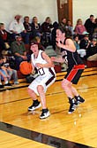 Dani Hanley protects the ball from a Hot Springs defender as she looks to see where her teammates are.