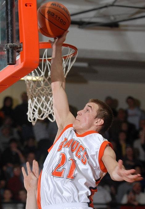 Flathead's Austin Roehl sails to the hoop during a Western AA game against Missoula Sentinel at Flathead on Friday night. Garrett Cheen/Daily Inter Lake&lt;br&gt;Sentinel takes Braves out in double overtime