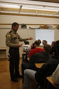 Sanders County Sheriff's deputy Chris McGuigen explains the legal ramifications of spreading offensive or sexually explicit materials via the internet or cell phone.