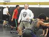 New wrestling coach moved here for family