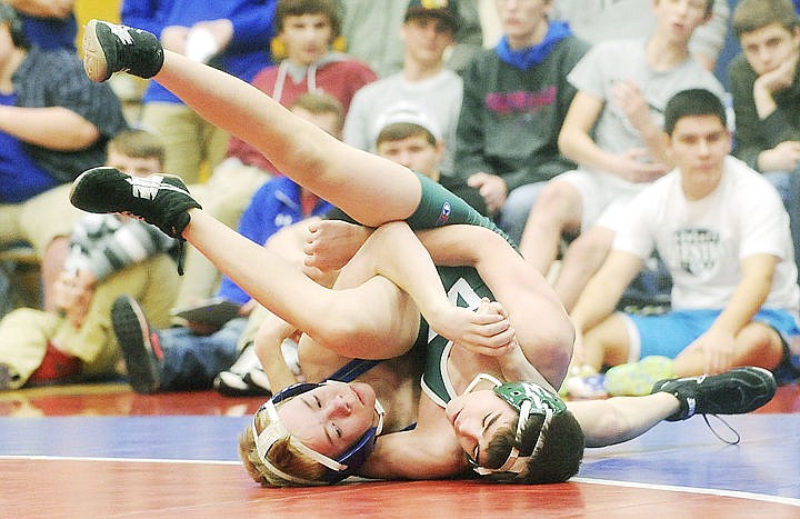 &lt;p&gt;Columbia Falls' Austin Nelson and Whitefish's Parker McWhirter scramble for position during the 103-pound match of the dual on Tuesday. Nelson won the match with a first-period pin. (Aaric Bryan/Daily Inter Lake)&lt;/p&gt;