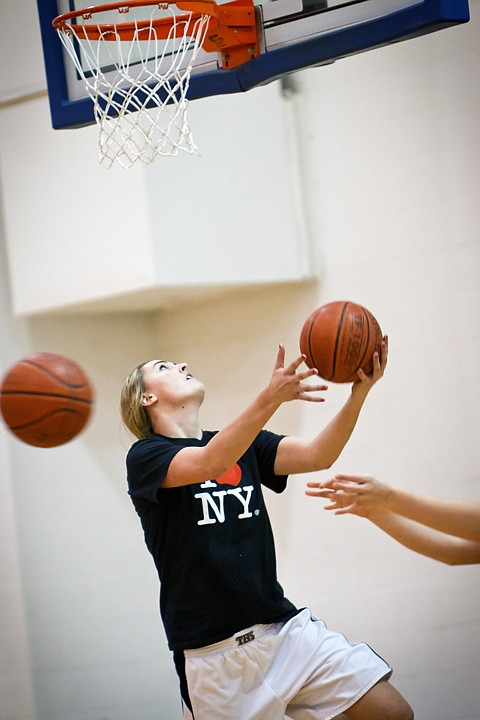 <p>Cassie Thompson works on lay-up drills Wednesday during practice at Timberlake High.</p>