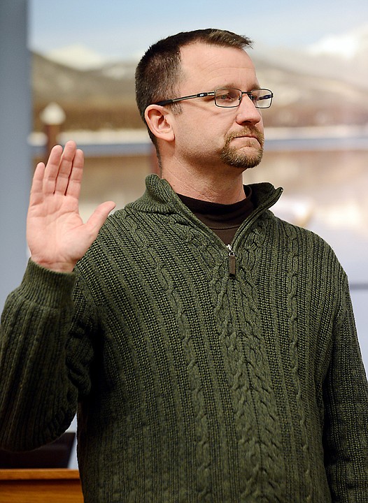 <p>Mark Johnson, the new mayor takes the oath of office on Monday evening, January 6, at City Hall in Kalispell. (Brenda Ahearn/Daily Inter Lake)</p>