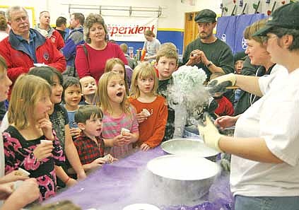 Brandon Roberts/The Western News Children at the Circus of Science parent night get ready for some homemade ice cream on display by University of Montana graduate student Alice Ryan.