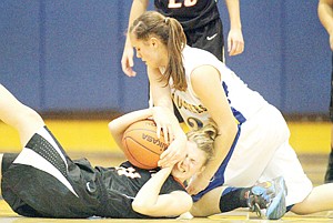 &lt;p&gt;Junior Devon Gallagher tied up with Emma Pyron fourth quarter jump ball vs. Frenchtown.&lt;/p&gt;