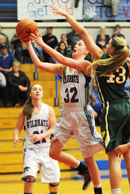<p>Columbia Falls' Kiara Burlage drives past Whitefish's Cailyn Ross for a shot in the first quarter at Columbia Falls on Thursday. (Aaric Bryan/Daily Inter Lake)</p>