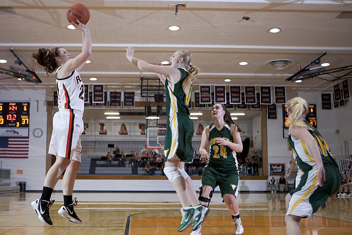 &lt;p&gt;Flathead's Ashlee O'Dell (left) shoots over a C. M. Russell
defender during the Bravettes loss to the Lady Rustlers Saturday at
Flathead High School.&lt;/p&gt;