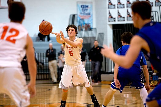 &lt;p&gt;Post Falls' Max McCullough passes to teammate David Bourgard (12) during the nail-biting second half of a match-up against Coeur d'Alene on Tuesday at Post Falls High School.&lt;/p&gt;