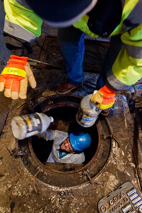 &lt;p&gt;Brian Bradshaw, environmental systems technician with the Kootenai County Solid Waste Department, is exchanges an empty bottle for a bottle containing recycled anti-freeze while winterizing the leachate evaporator.&lt;/p&gt;