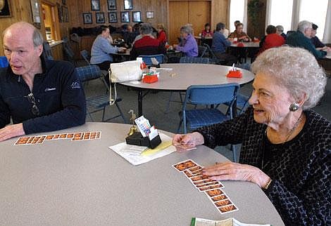 Hensleigh enjoys a game of bridge with Gary Stephens on Friday. Garrett Cheen/Daily Inter Lake