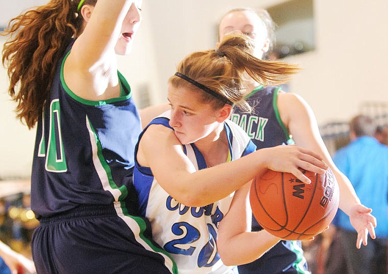 &lt;p&gt;Stillwater Christian junior Janelle Falk (20) looks to pass around Glacier freshman Nikki Krueger (40) Tuesday night during Stillwater Christian's matchup against Glacier junior varsity at Stillwater Christian School. Jan. 14, 2014 in Kalispell, Montana. (Patrick Cote/Daily Inter Lake)&lt;/p&gt;