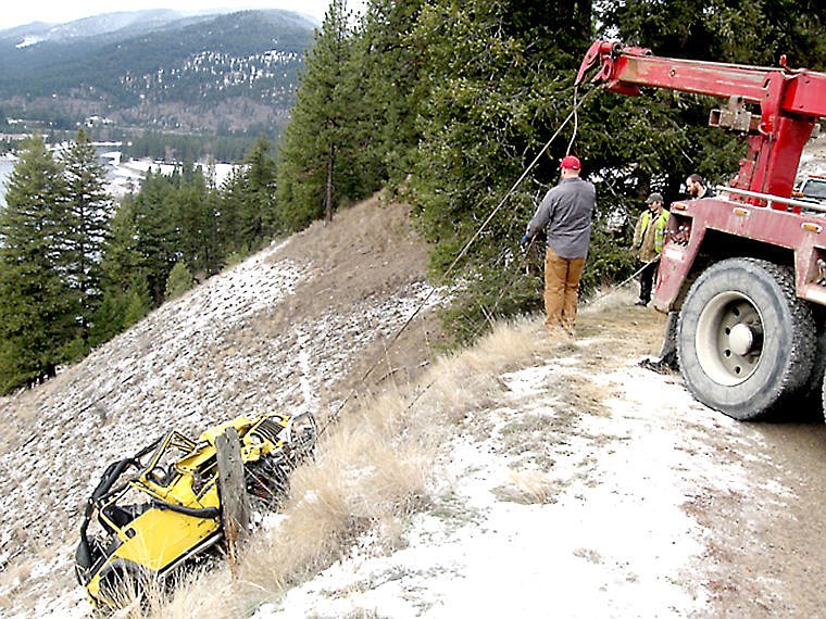 &lt;p&gt;A crew from Schober's Towing pull a wrecked Jeep from where it landed in the Clark Fork River after sliding off the icy road.&lt;/p&gt;