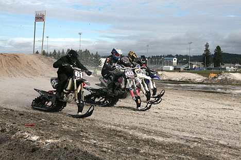 &lt;p&gt;Snow bike racers from left, Ty Oliver, Derick Driggs, Wade Bennett and Allen Mangum charge off the starting line at the Kootenai County Fairgrounds on Saturday during a Mountain West Racing sno-cross competition.&lt;/p&gt;