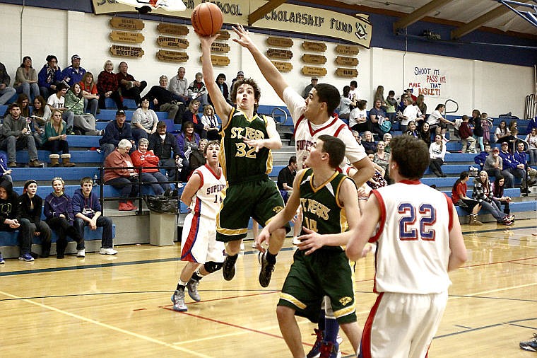 &lt;p&gt;St. Regis sophomore Dakota Wickham makes an athletic move to get to the basket on Thursday.&lt;/p&gt;