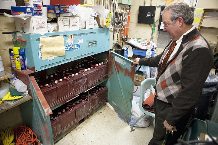 &lt;p&gt;Principal Dave Carlson shows off the backup electrical system at
Whitefish High School Thursday evening. The backup system, which
powers emergency lights in case of a power failure, is made up of
20 batteries.&lt;/p&gt;