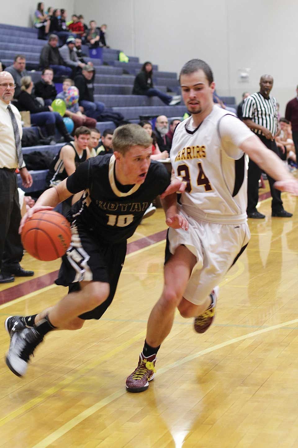 Royal sophomore Kaden Jenks drives around a Cle Elum defender.