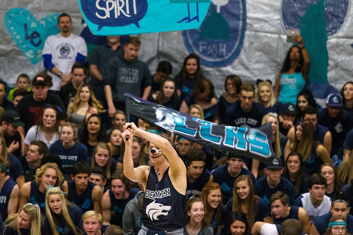 &lt;p&gt;Lake City&#146;s Oskar Owens waves his school&#146;s flag during a halftime performance on Friday night.&lt;/p&gt;