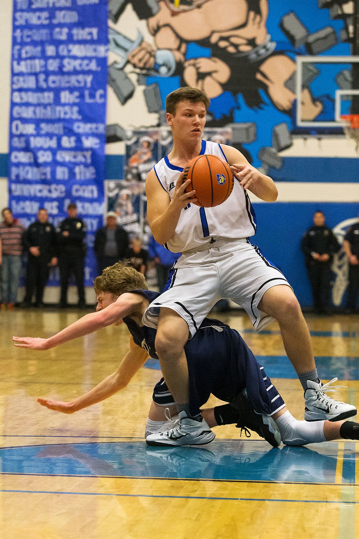 &lt;p&gt;Coeur d&#146;Alene&#146;s Austin Lee is tripped after Lake City&#146;s Kyle Manzardo falls to the floor during the first quarter of the boys game.&lt;/p&gt;