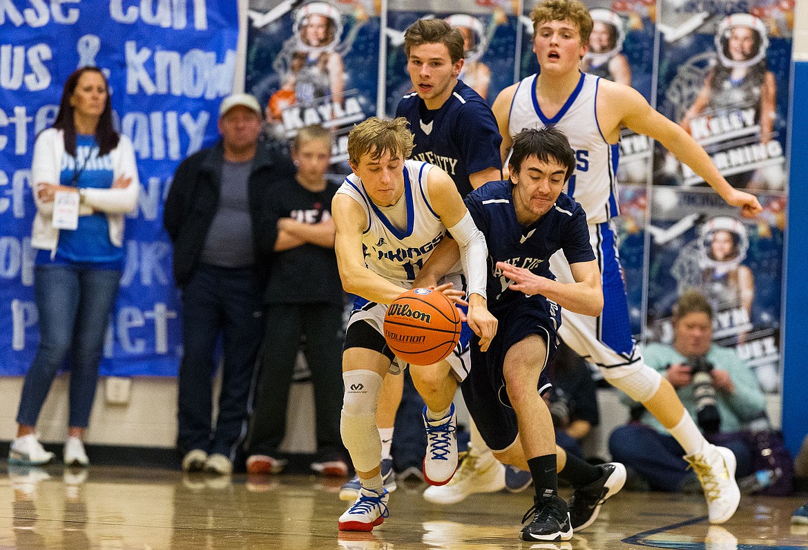 &lt;p&gt;Coeur d&#146;Alene&#146;s Jakob Lynn races Lake City&#146;s Andrew Womelduff for possession of the ball in the first half of the &#147;Fight for the Fish&#148; boys basketball game on Friday.&lt;/p&gt;