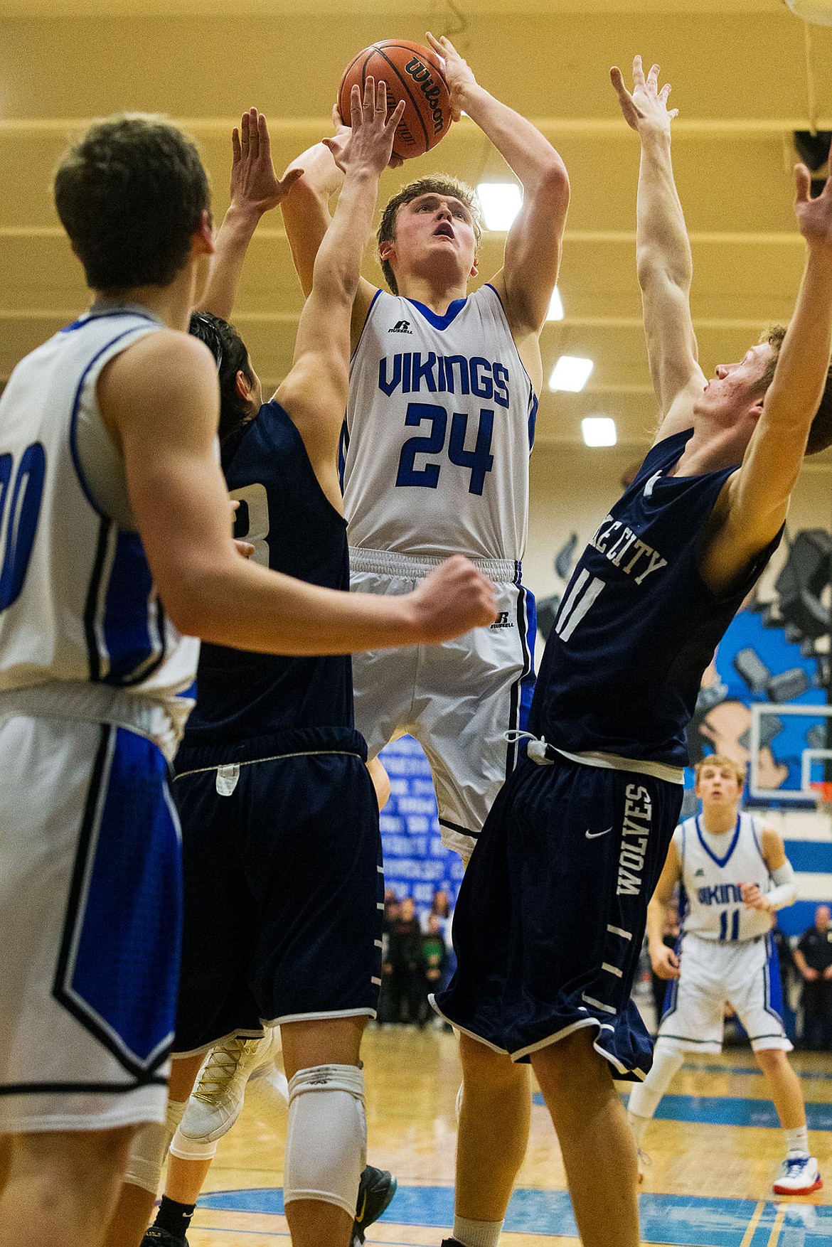 &lt;p&gt;Coeur d&#146;Alene High&#146;s Joey Naccarato goes up above a pair of Lake City defenders for a jump shot during the third quarter Friday at Coeur d&#146;Alene High School.&lt;/p&gt;