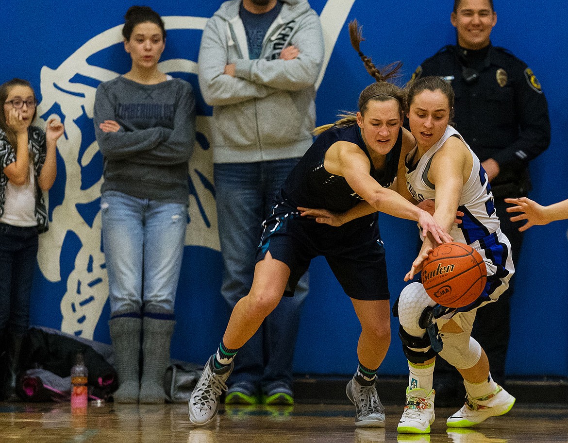 &lt;p&gt;Coeur d&#146;Alene High&#146;s Isabella Hollibaugh battles Lake City High&#146;s Bridget Rieken for a loose ball during the second half.&lt;/p&gt;