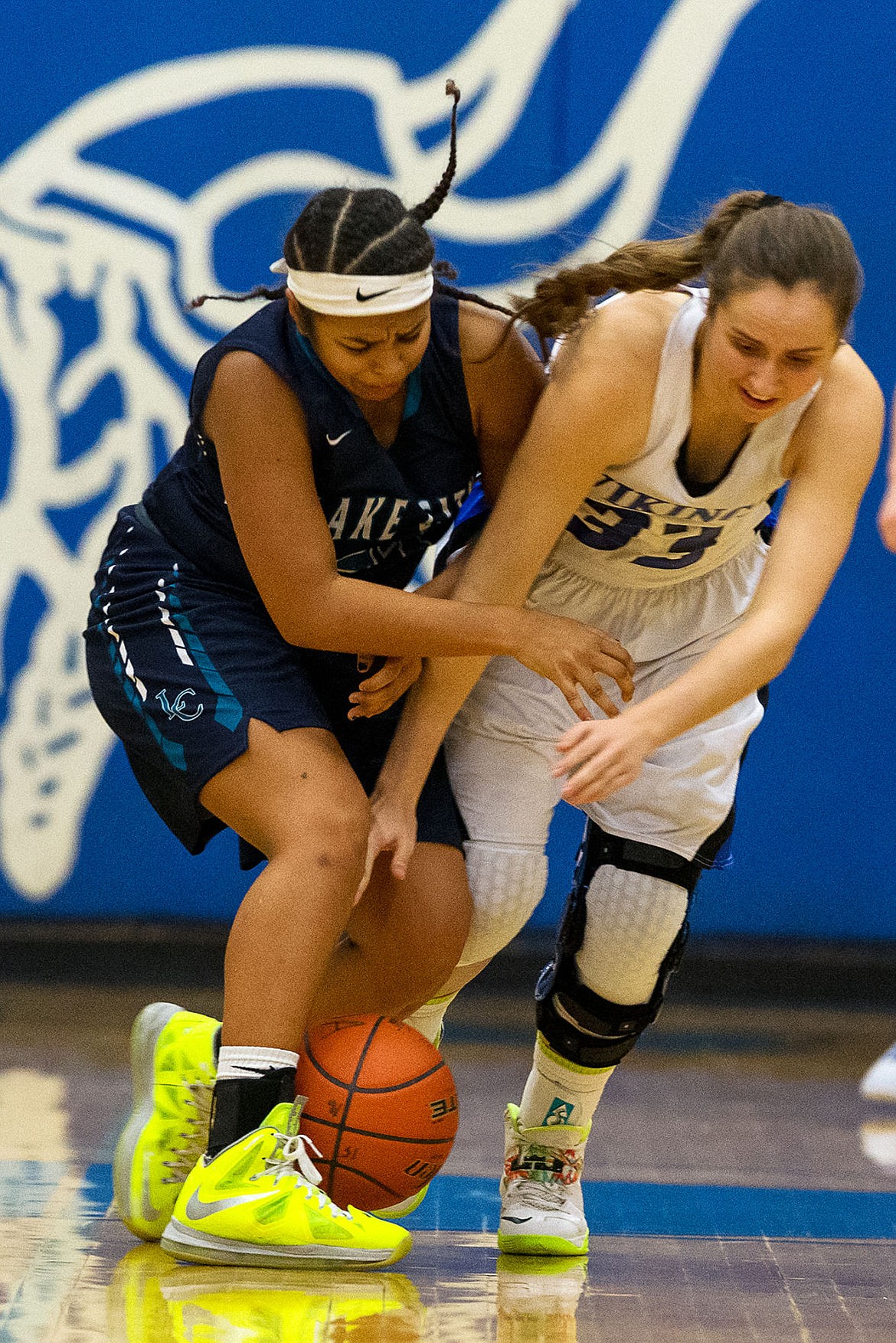 <p>Lake Citys Whitney Meier and Coeur dAlenes Isabella Hollibaugh battle for a loose ball in the first quarter.</p>