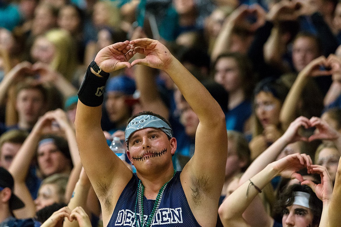 &lt;p&gt;Dominic Conigliaro leads the Lake City student section in a hand gesture of hearts as the judges of the &#147;Fight for the Fish&#148; competition are introduced.&lt;/p&gt;