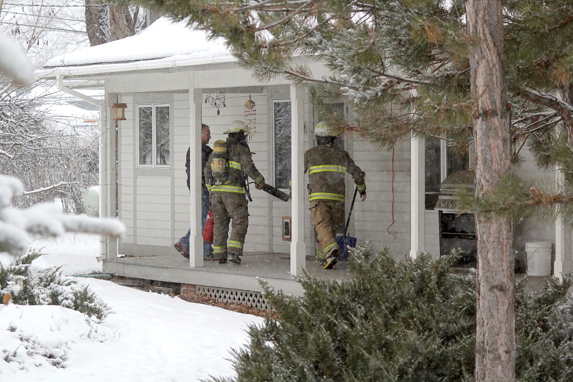 &lt;p&gt;Firefighters from Plains City Fire prepare to enter a home on Stanton Street to handle a fire in the oven.&lt;/p&gt;