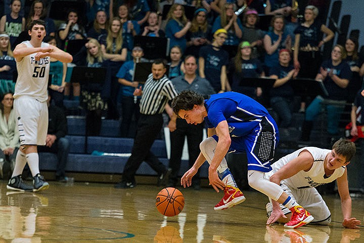 &lt;p&gt;Coeur d&#146;Alene High&#146;s Brody Lundblad gets possession of a loose ball as Lake City&#146;s Michael Goggin falls to the floor.&lt;/p&gt;