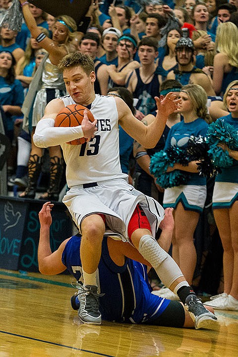 &lt;p&gt;Lake City High School&#146;s Colin Hunter is taken of his feet as a Coeur d&#146;Alene defender falls to the floor.&lt;/p&gt;