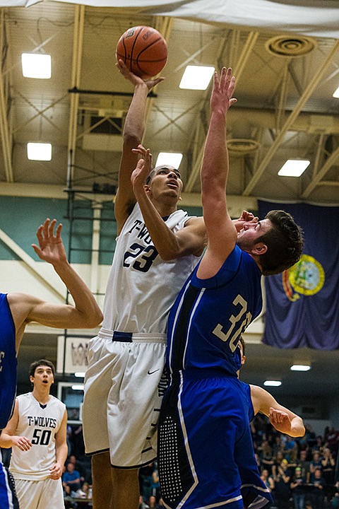 &lt;p&gt;Lake City&#146;s Jeremy Hughes (23) put up a shot over Coeur d&#146;Alene&#146;s Elliott Sparks (30).&lt;/p&gt;