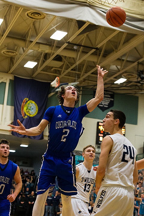 &lt;p&gt;Coeur d&#146;Alene High School&#146;s Brody Lundblad (2) goes up for two over Lake City&#146;s Joe Pasquale (24).&lt;/p&gt;