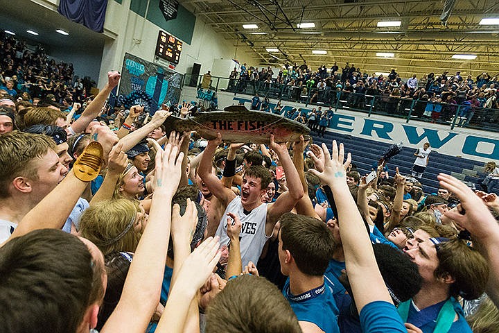 &lt;p&gt;Lake City&#146;s High School&#146;s Michael Goggin raises &#147;The Fish&#148; in a sea of celebrating students after the Timberwolves were announced the winners of the cross-town spirit competition against Coeur d&#146;Alene High on Friday night.&lt;/p&gt;