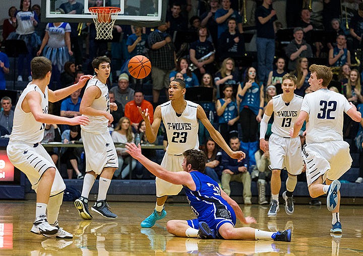 &lt;p&gt;Lake City&#146;s Jeremy Hughes gains possession of a loose ball after Coeur d&#146;Alene&#146;s Elliott Sparks falls to the ground during the second quarter Friday at Lake City High School.&lt;/p&gt;