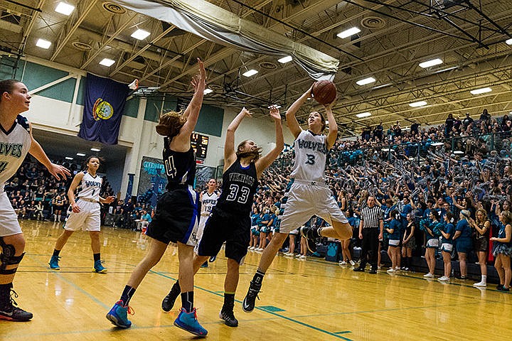 &lt;p&gt;Lake City&#146;s Nina Carlson goes up for two points over a pair of Coeur d&#146;Alene defenders.&lt;/p&gt;